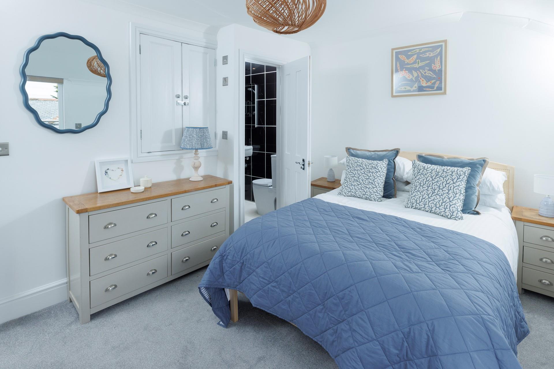 This cosy bedroom is decorated with coastal blues.