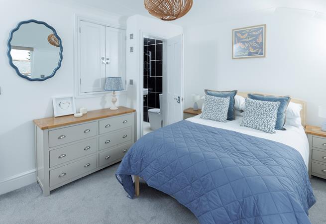 This cosy bedroom is decorated with coastal blues.