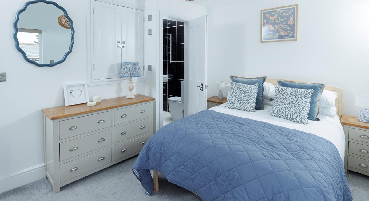 This cosy bedroom is decorated with coastal blues.