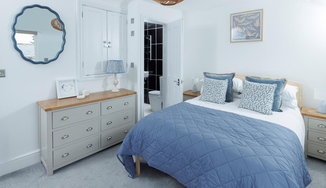 This cosy bedroom is decorated with coastal blues.