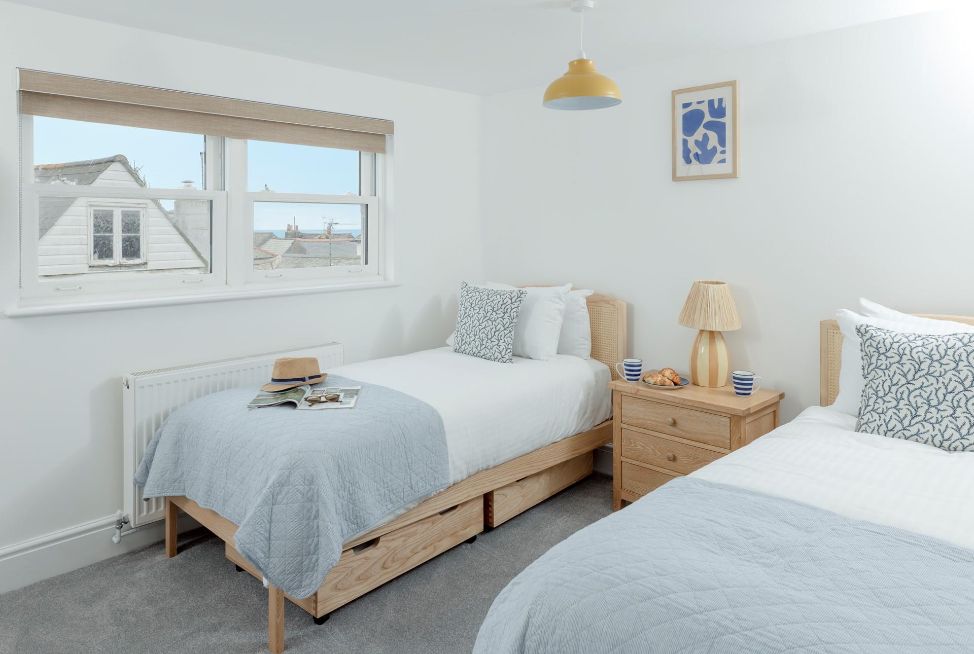 There are sea views over the rooftops from the twin room.