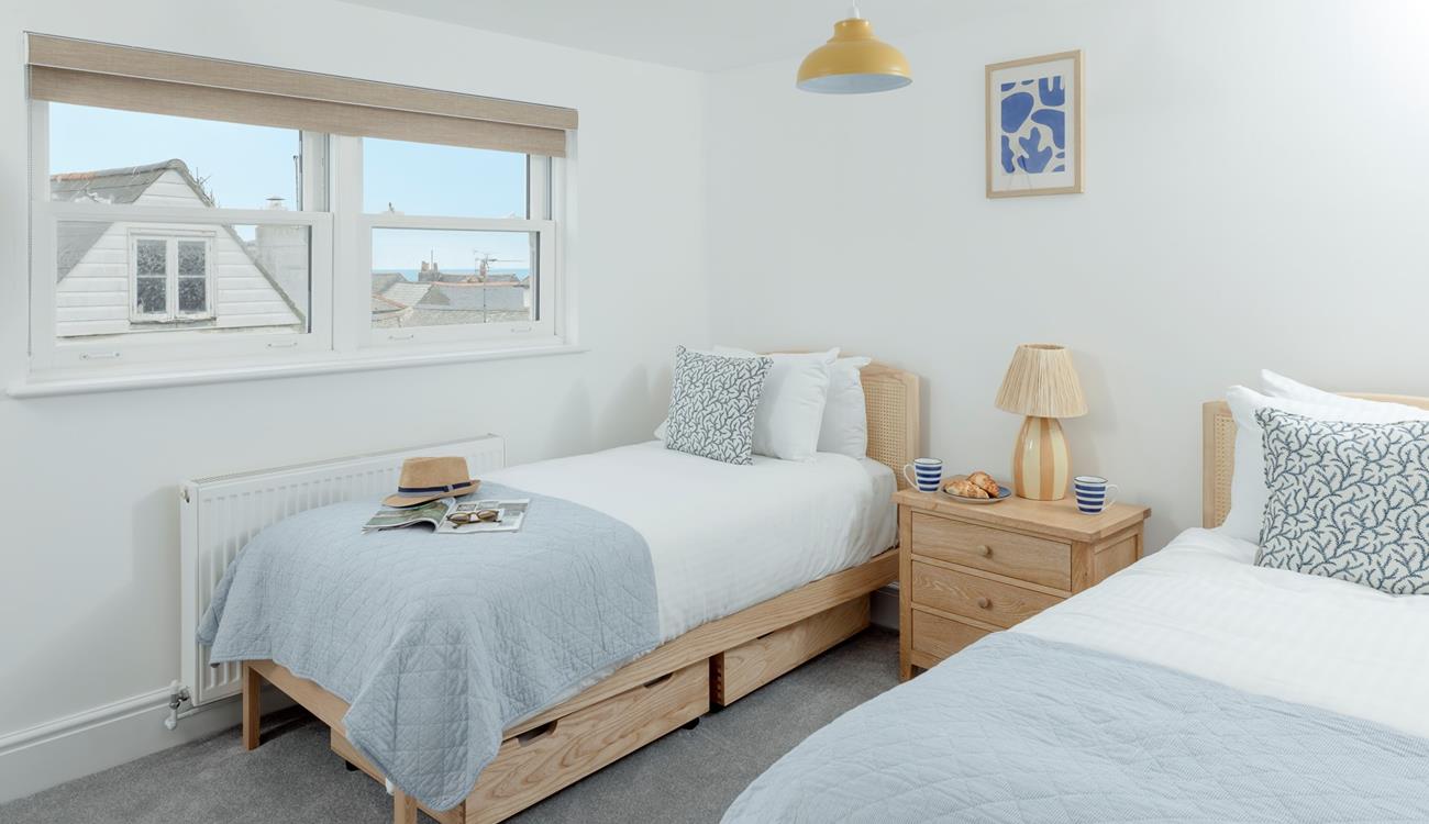 There are sea views over the rooftops from the twin room.