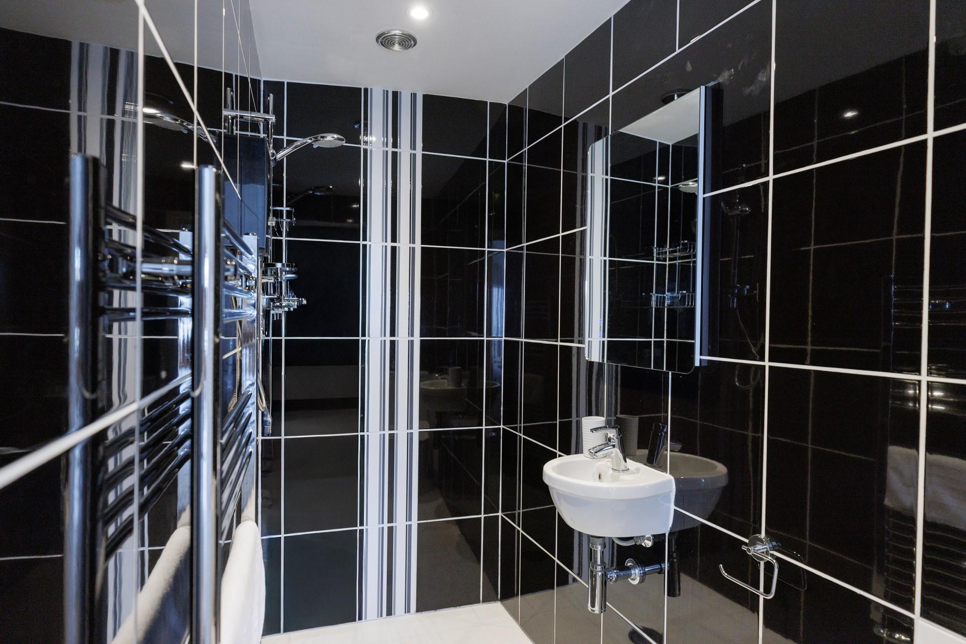 The en suite shower room is a great space to get ready each morning.
