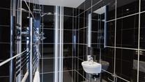 The en suite shower room is a great space to get ready each morning.