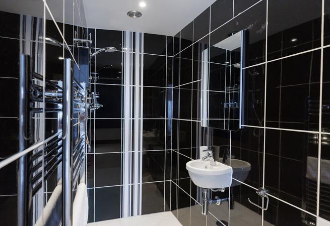 The en suite shower room is a great space to get ready each morning.
