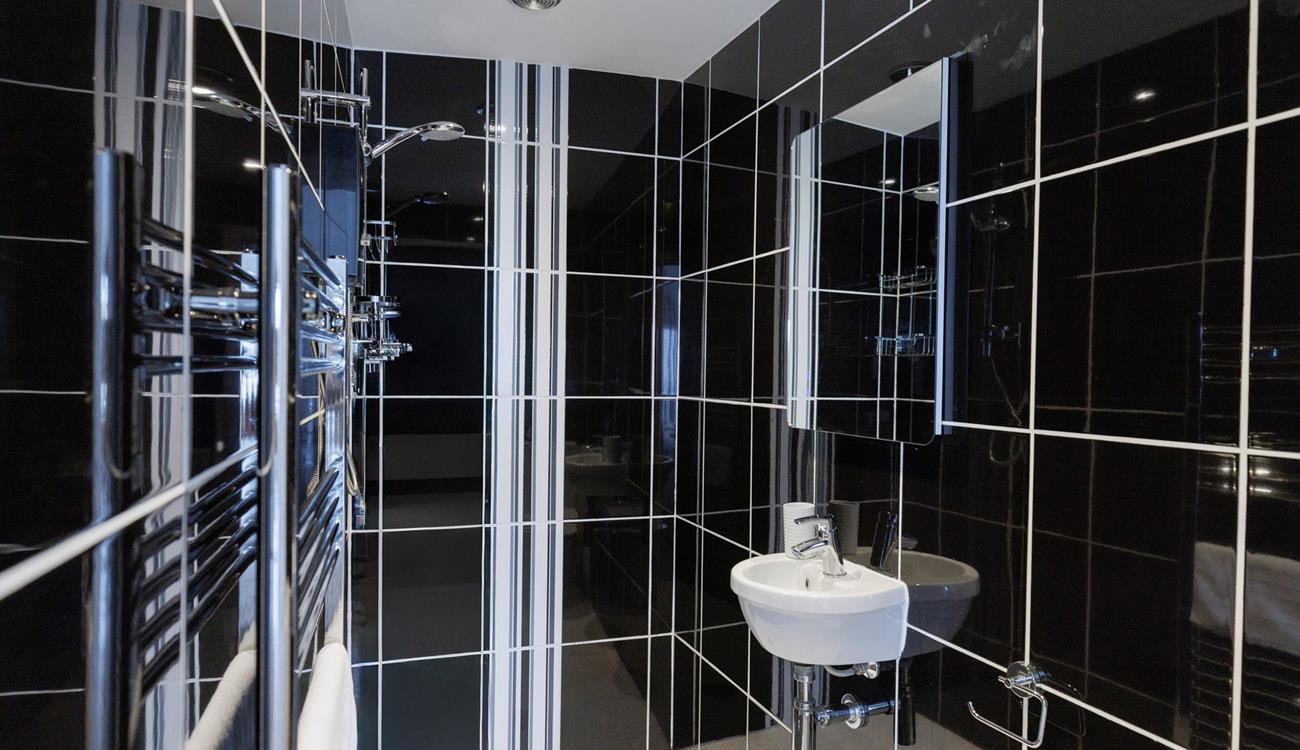 The en suite shower room is a great space to get ready each morning.
