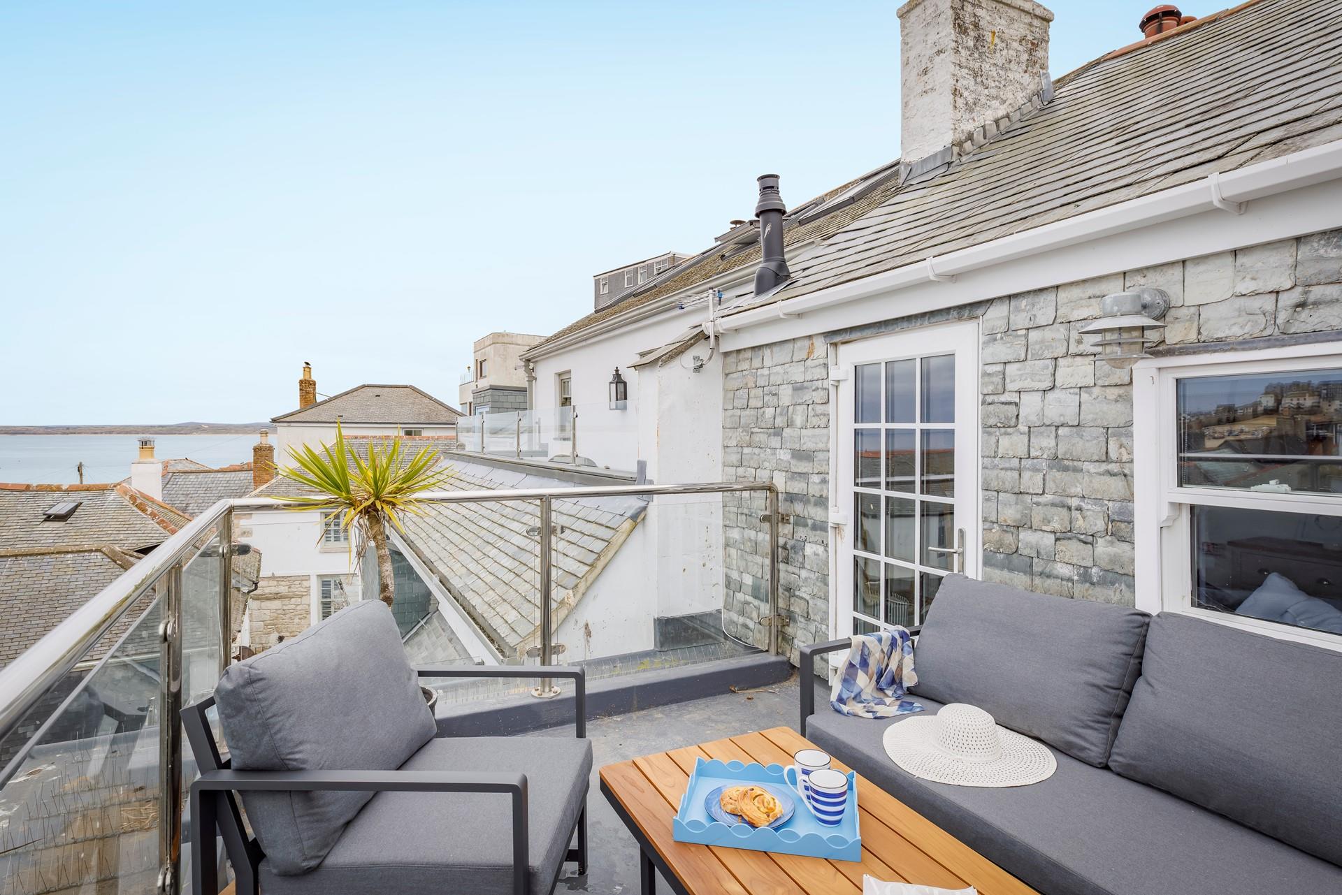 Sip the first coffee of the day and take in the sea view from the roof terrace.