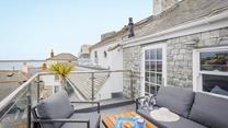 Sip the first coffee of the day and take in the sea view from the roof terrace.