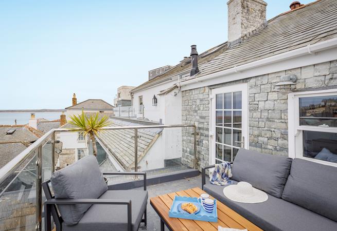 Sip the first coffee of the day and take in the sea view from the roof terrace.