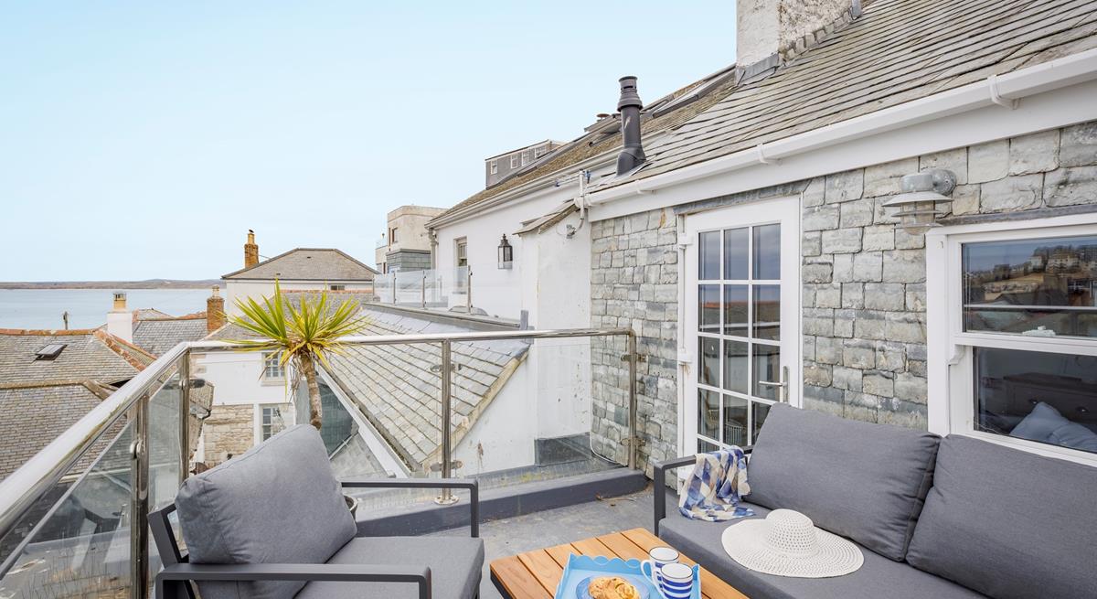 Sip the first coffee of the day and take in the sea view from the roof terrace.