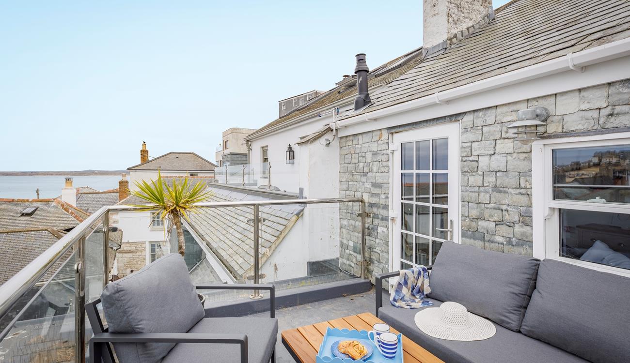 Sip the first coffee of the day and take in the sea view from the roof terrace.