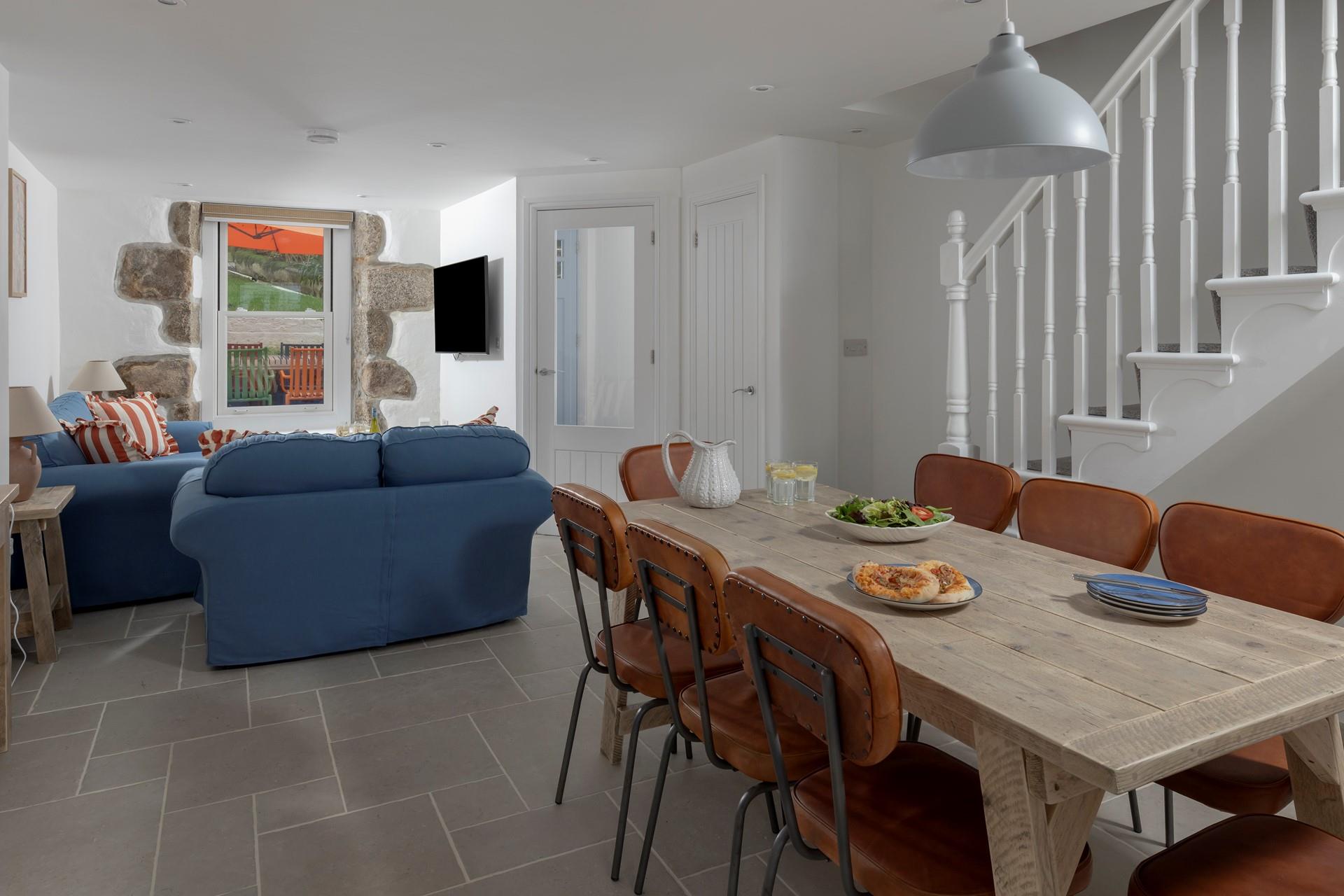 Tastefully decorated, the sitting room is a cosy space to relax and unwind.