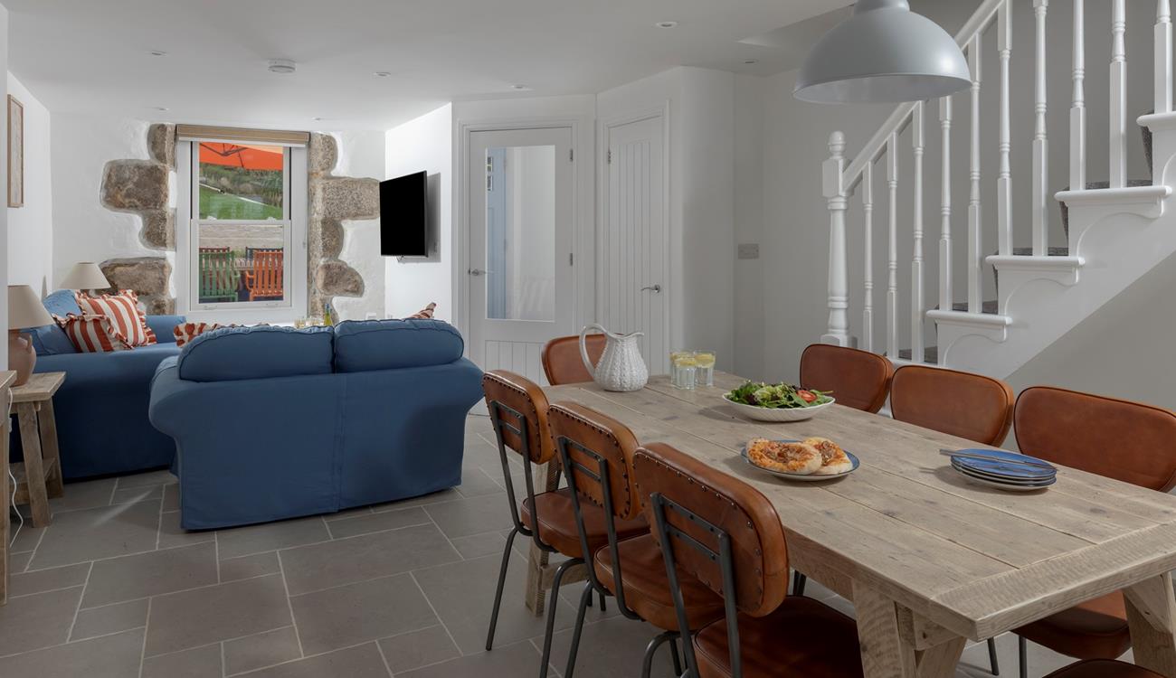 Tastefully decorated, the sitting room is a cosy space to relax and unwind.