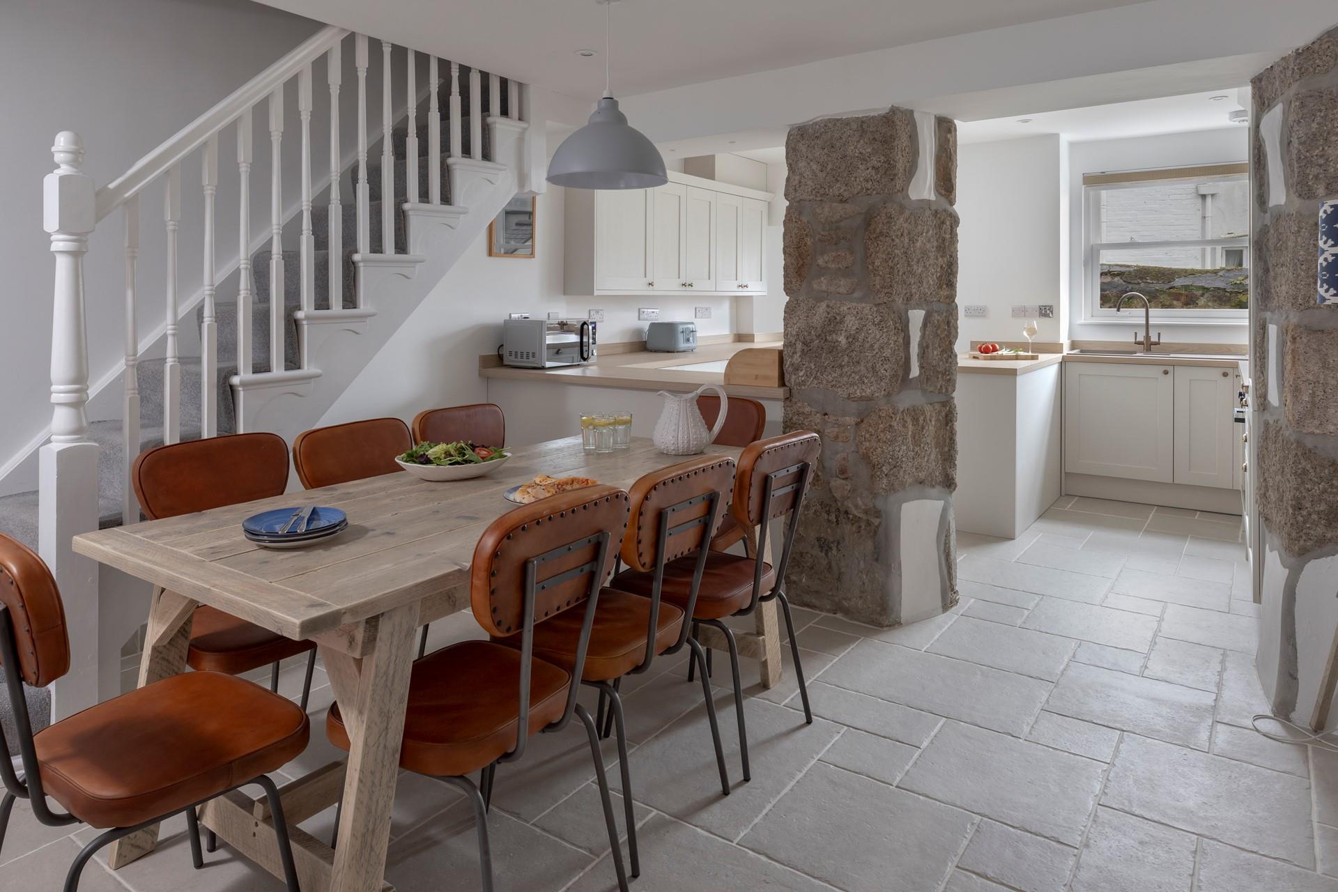 The dining table seats 8 comfortably, ideal for the family to enjoy meals together.