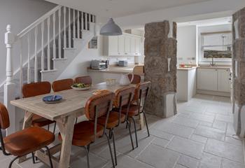 The dining table seats 8 comfortably, ideal for the family to enjoy meals together.