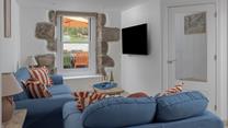 The open plan living space is the ideal cosy base to return to each day.
