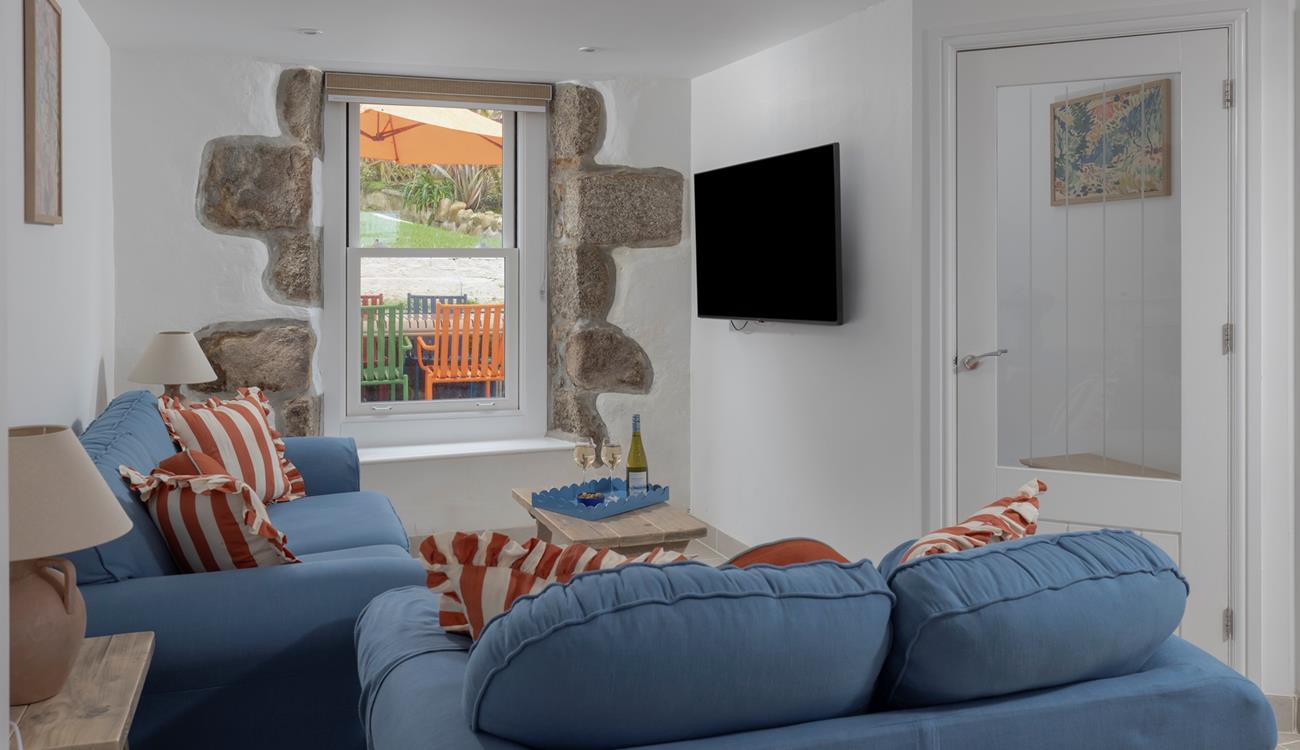 The open plan living space is the ideal cosy base to return to each day.