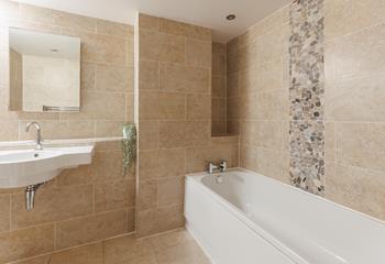 The modern family bathroom makes getting ready for the day a breeze.