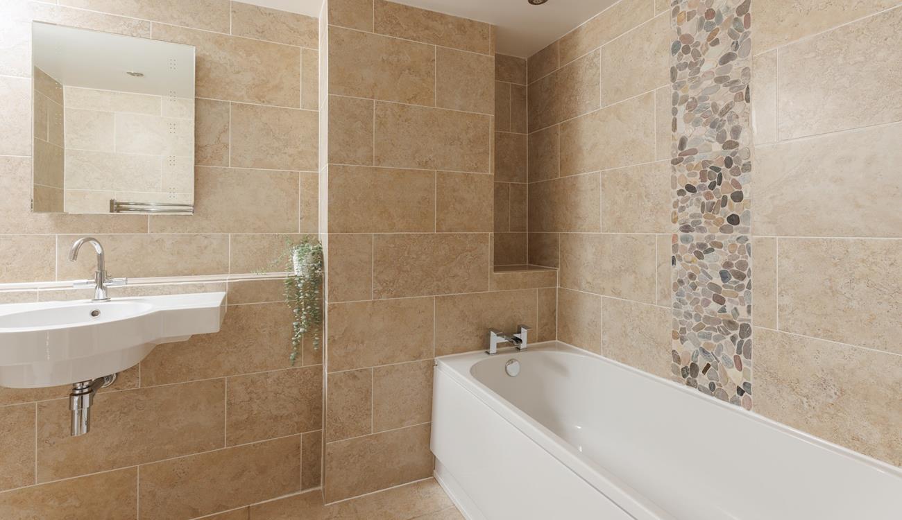 The modern family bathroom makes getting ready for the day a breeze.