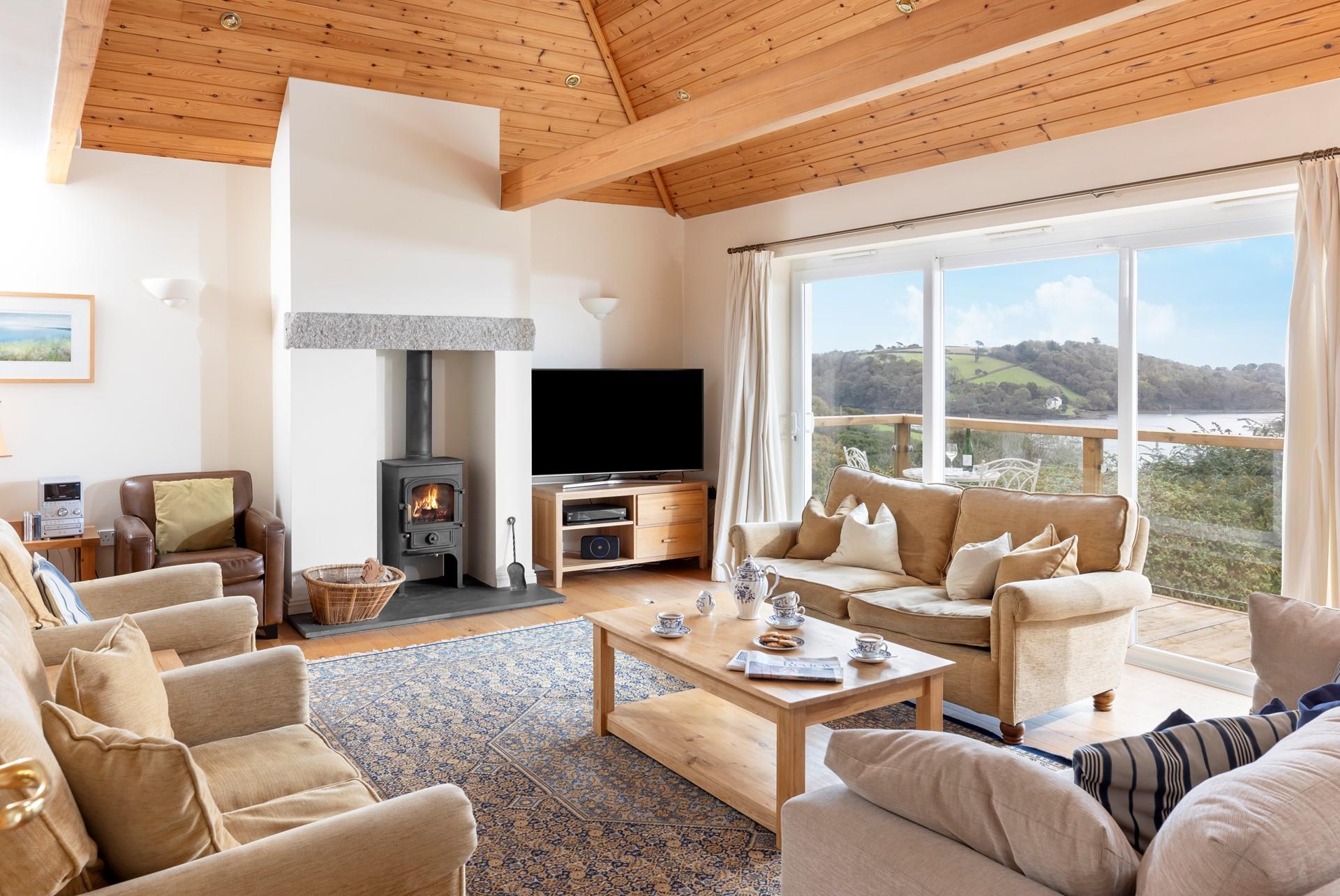 The sitting room also takes advantage of the waterside views.