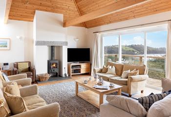 The sitting room also takes advantage of the waterside views.