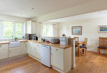 The open-plan kitchen and dining area is perfect for entertaining and creating culinary delights.
