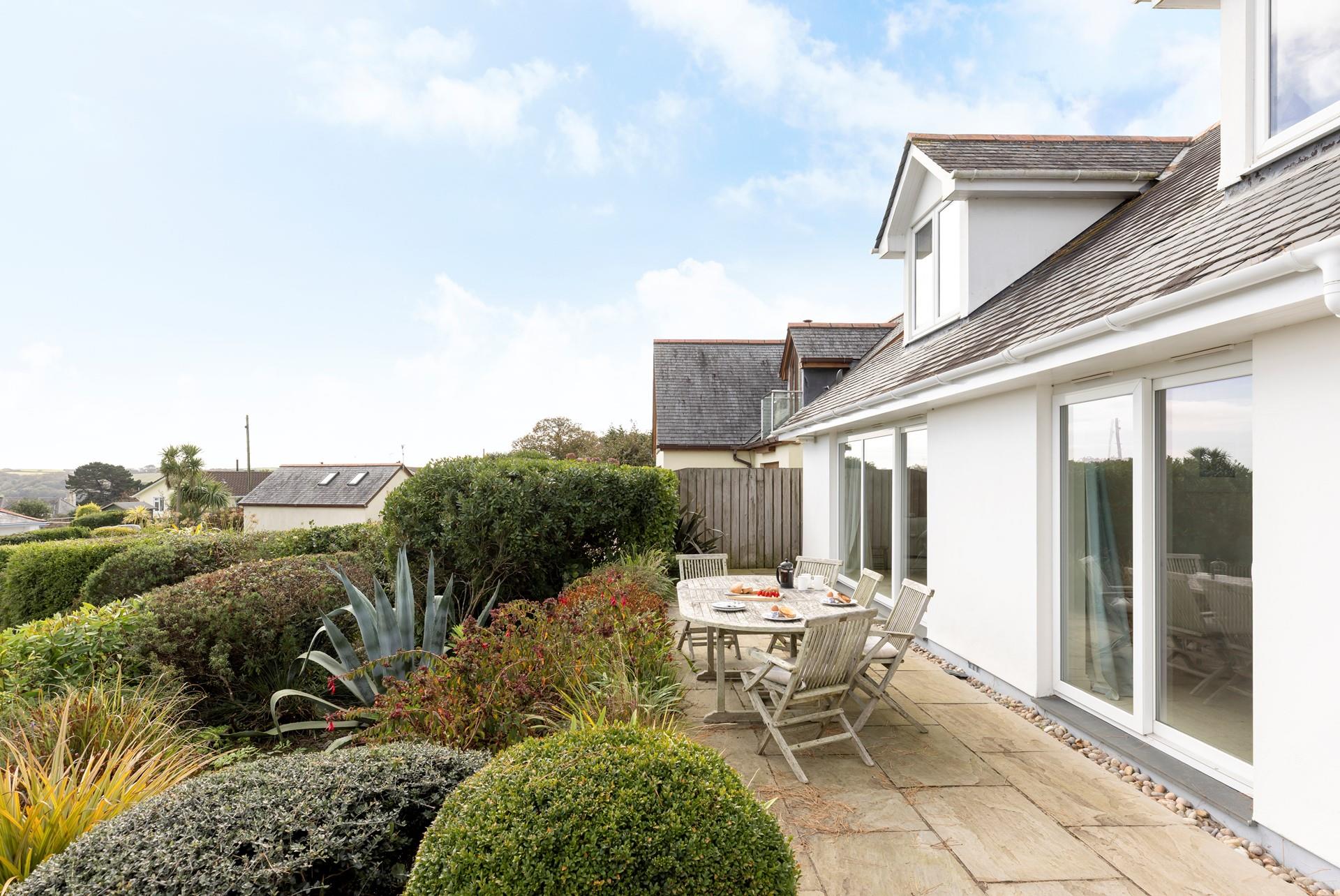 The blooming garden is a relaxing spot to enjoy a cup of coffee.