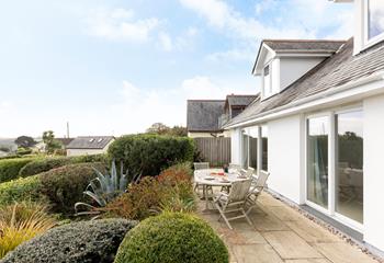 The blooming garden is a relaxing spot to enjoy a cup of coffee.