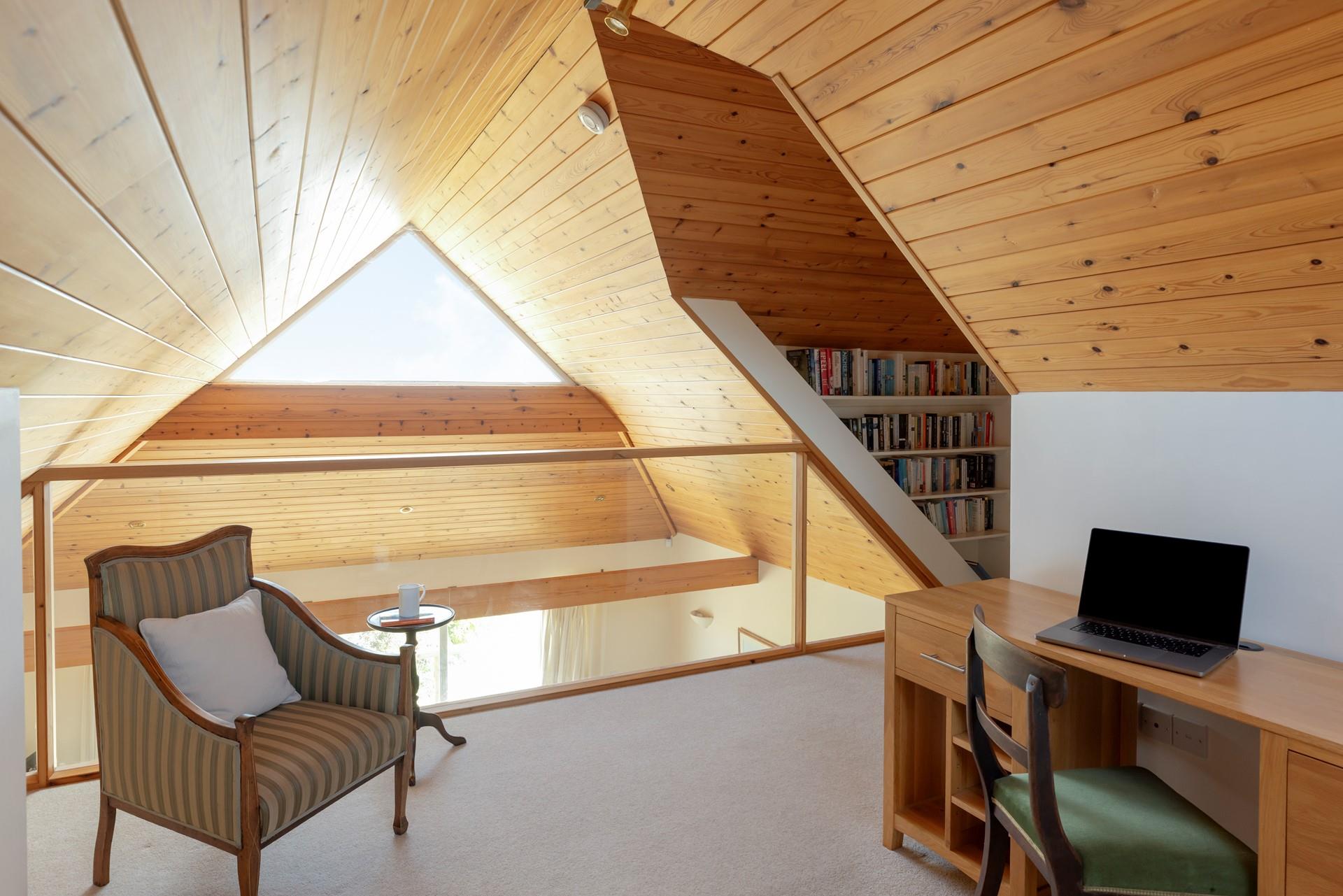 Above the sitting area, you will find a nook perfect for reading or catching up on work.