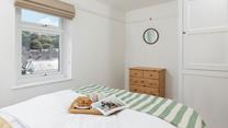 The master bedroom offers views across the rooftops.