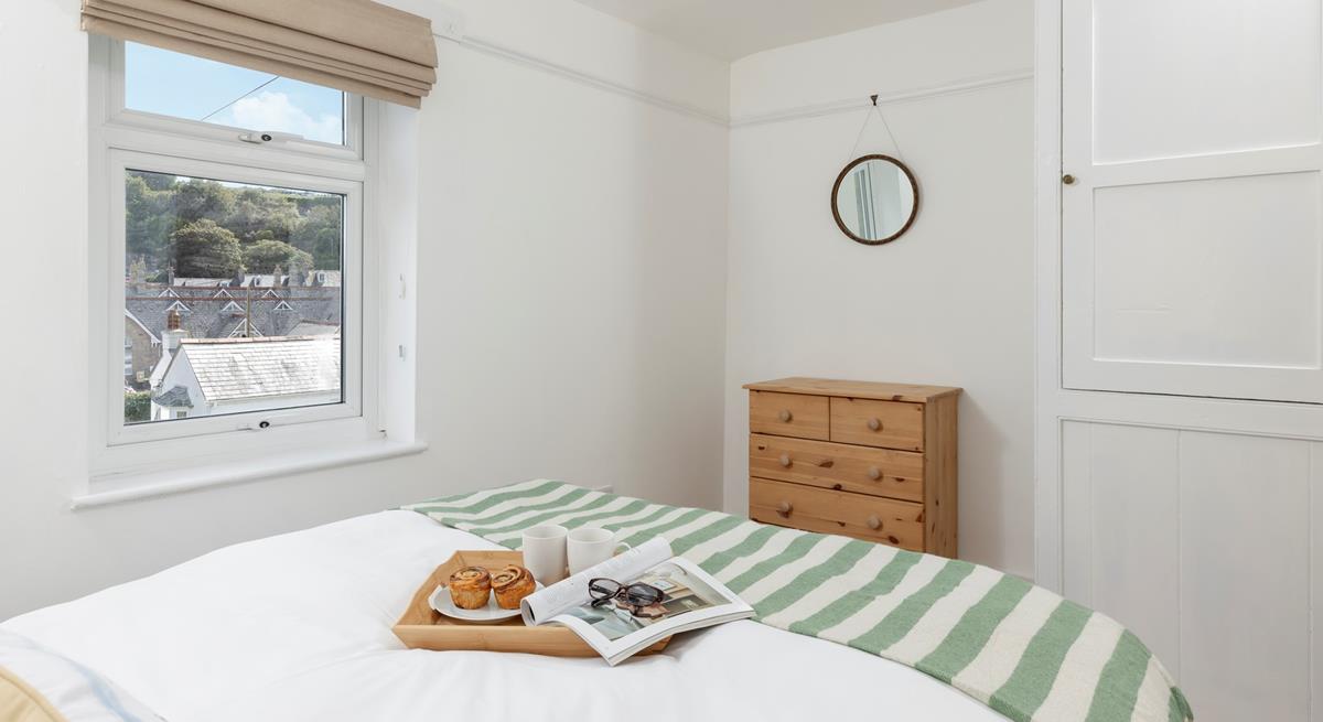 The master bedroom offers views across the rooftops.