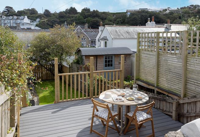 From the sundeck, step onto the enclosed lawn area.