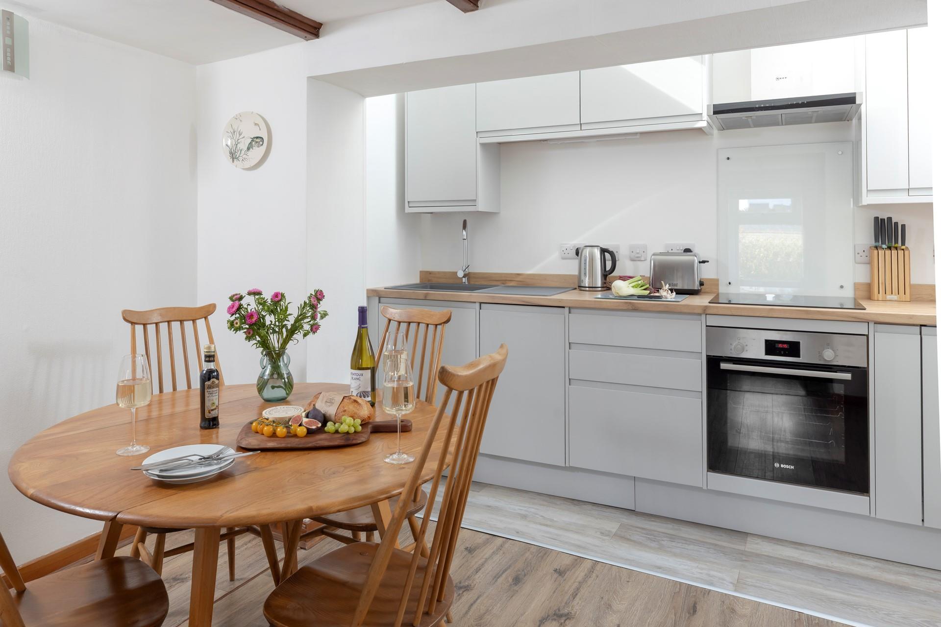 The kitchen and dining area has all you need for a relaxing stay.
