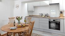 The kitchen and dining area has all you need for a relaxing stay.