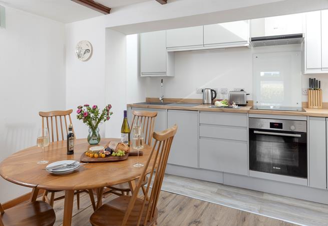 The kitchen and dining area has all you need for a relaxing stay.