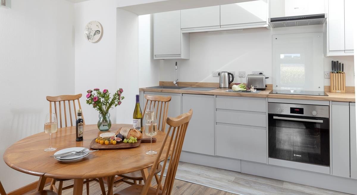 The kitchen and dining area has all you need for a relaxing stay.