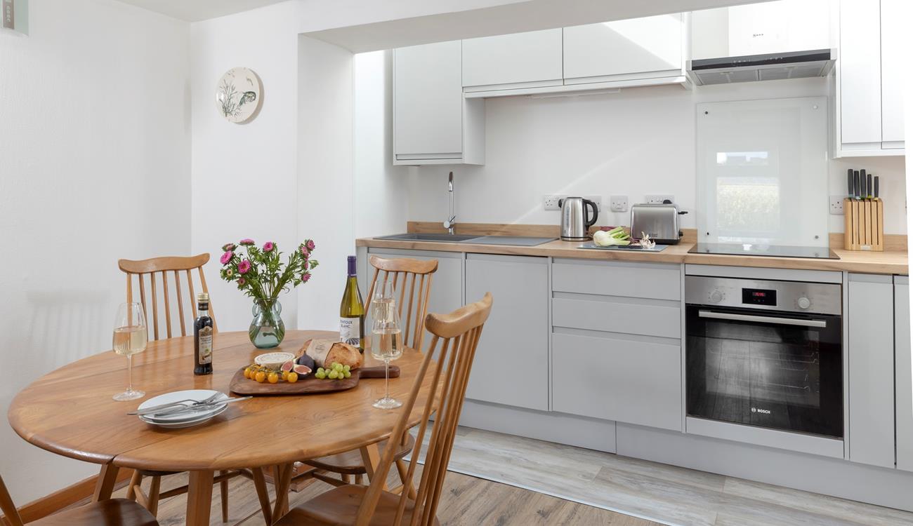 The kitchen and dining area has all you need for a relaxing stay.