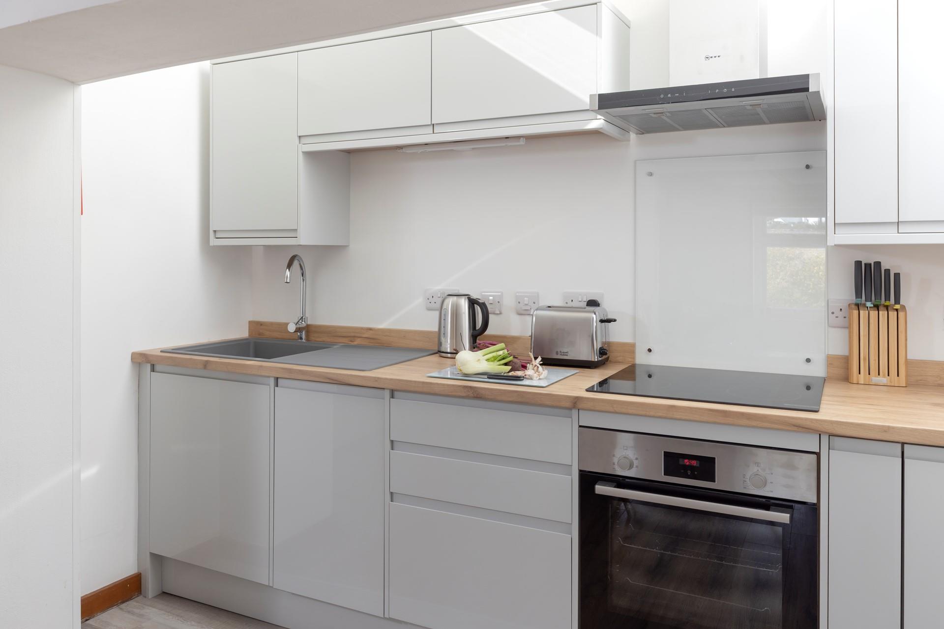 The kitchen is compact and well-equipped.