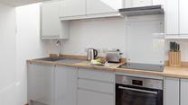 The kitchen is compact and well-equipped.