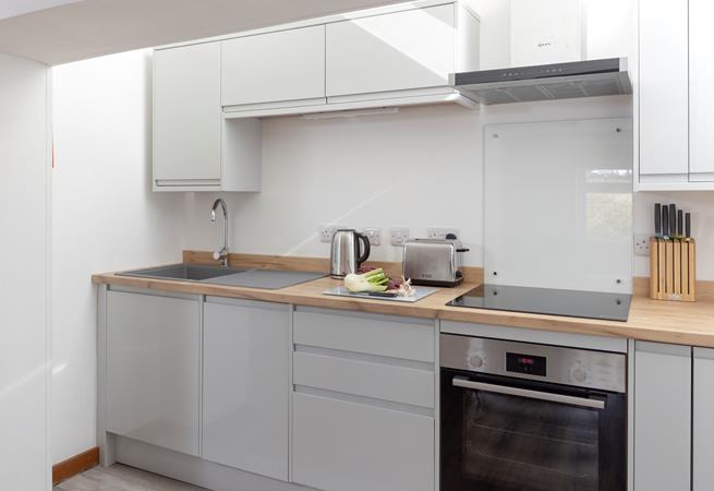 The kitchen is compact and well-equipped.