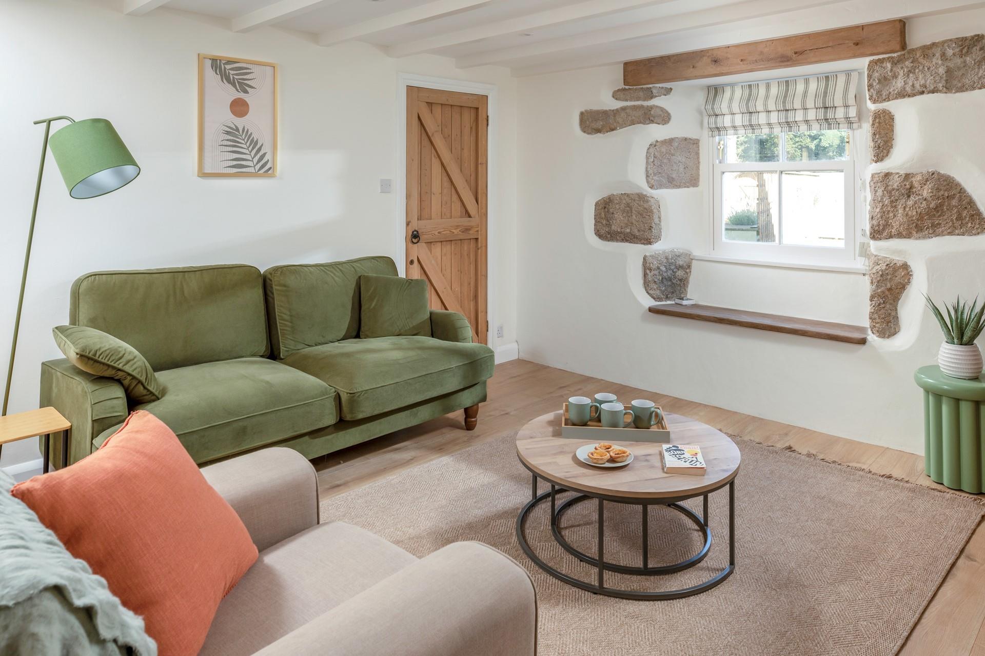 The sitting room is decorated with cosy and modern furnishings.