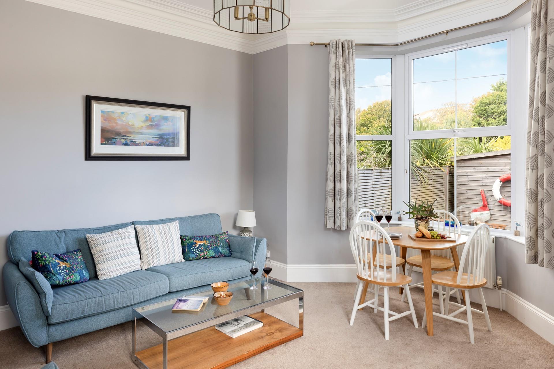 The welcoming sitting room invites you to unwind after days out.