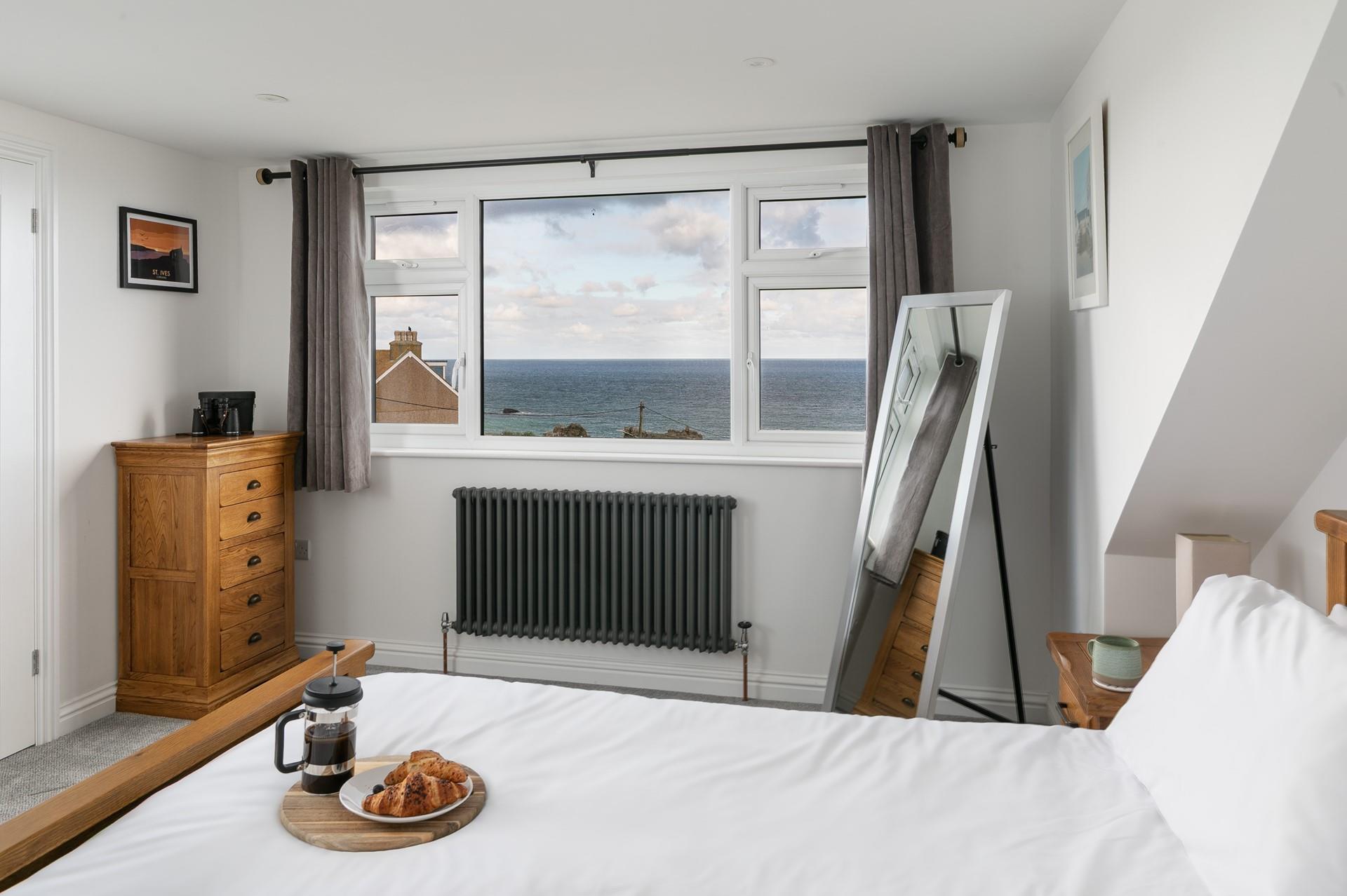 Open the curtains and decide on the day's plans whilst gazing out to sea.