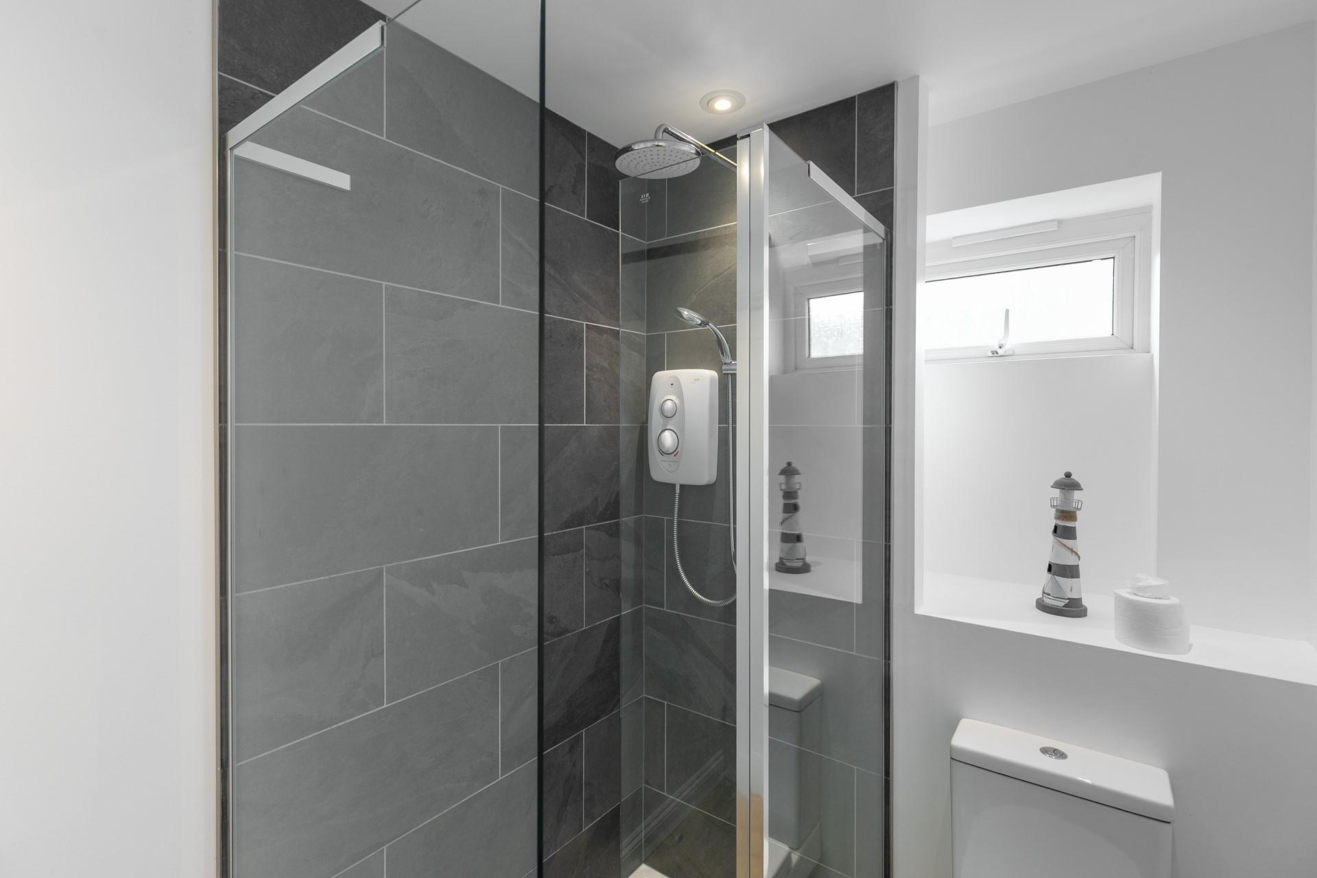 Wash the day away in the family shower room.