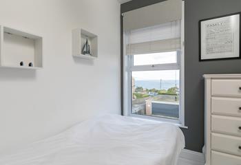 The single room provides an additional space for guests to enjoy a relaxing night's sleep.