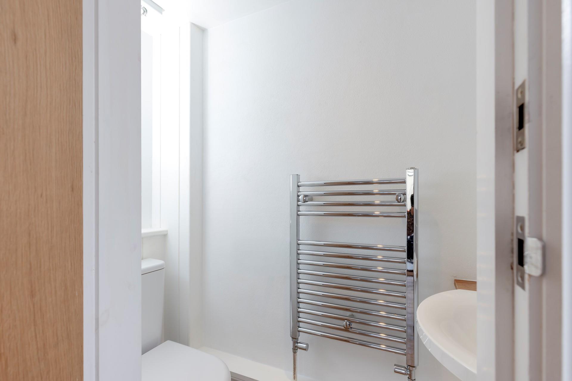 The cloakroom has a WC and a basin.