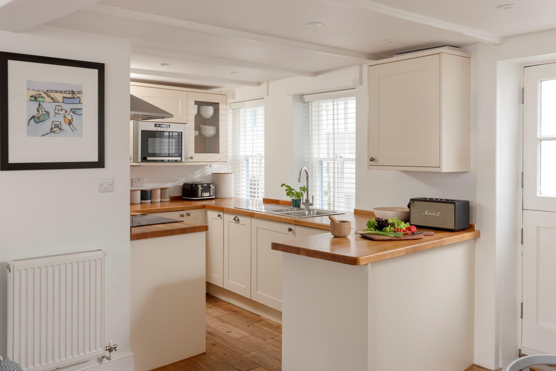 The kitchen is modern and fully equipped.