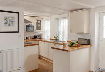 The kitchen is modern and fully equipped.