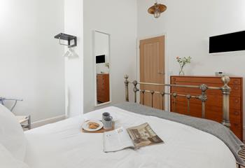 Sip a cup of tea in bed while deciding on your day's agenda.