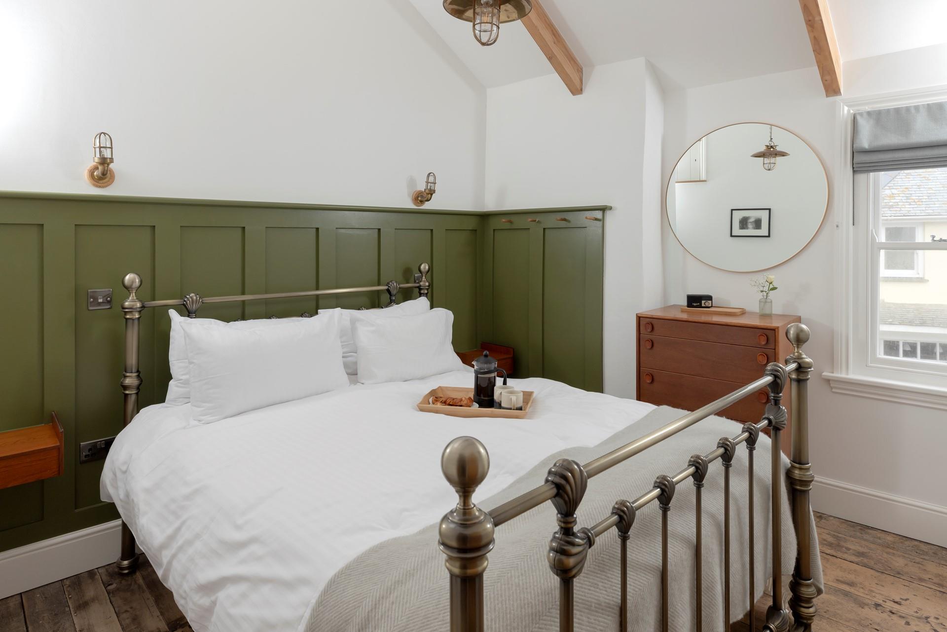 Bedroom 2 is tastefully decorated with earthy tones.